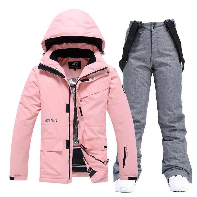 Women's 2-piece ski suit by The Clothing Company Sydney featuring waterproof snowboard jacket and snow pants for winter sports.