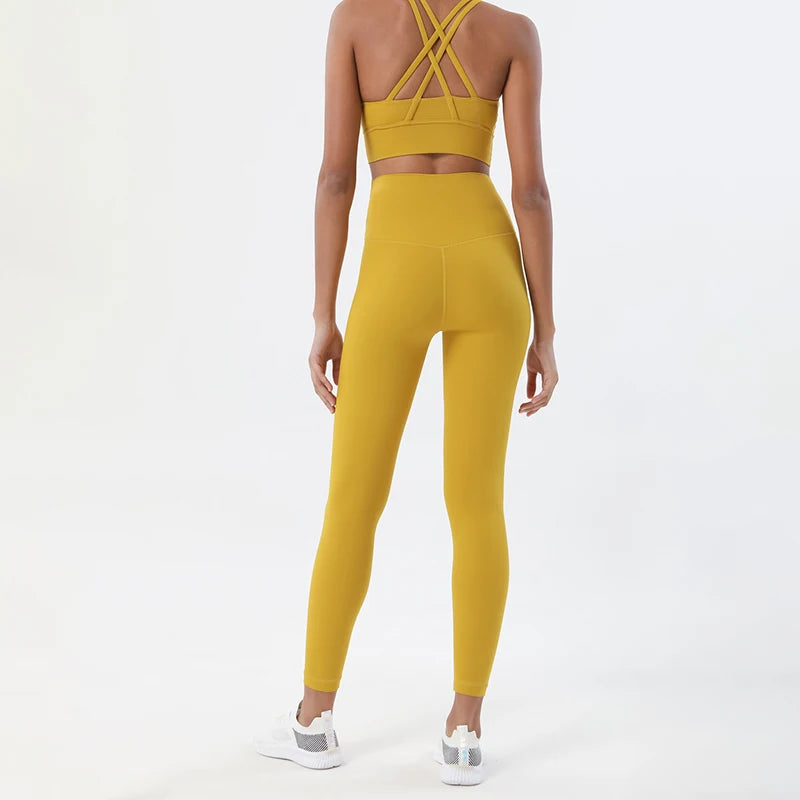 Nylon women's yoga and fitness tracksuit by The Clothing Company Sydney, includes breathable sports bra and leggings for gym workouts.