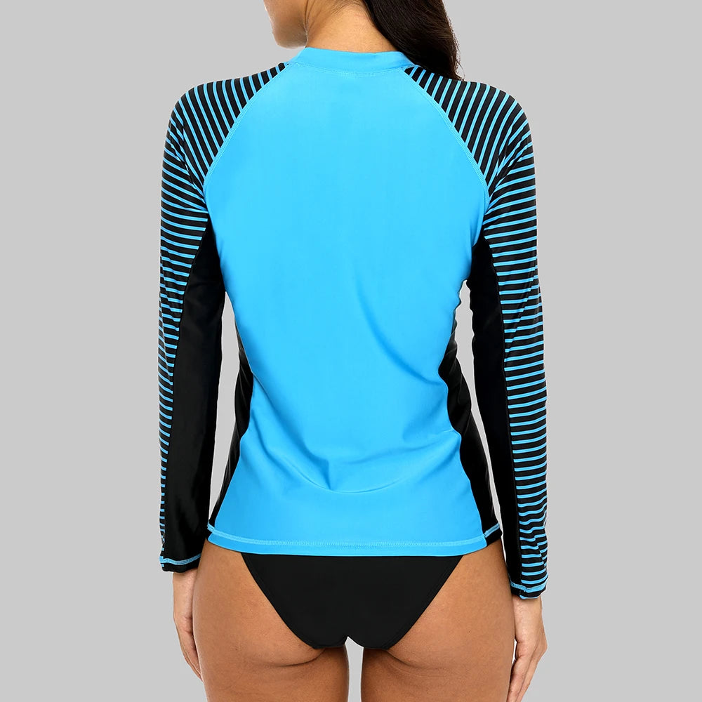 Women's long-sleeved striped rashguard swimwear by The Clothing Company Sydney, featuring patchwork design and UPF50+ sun protection.