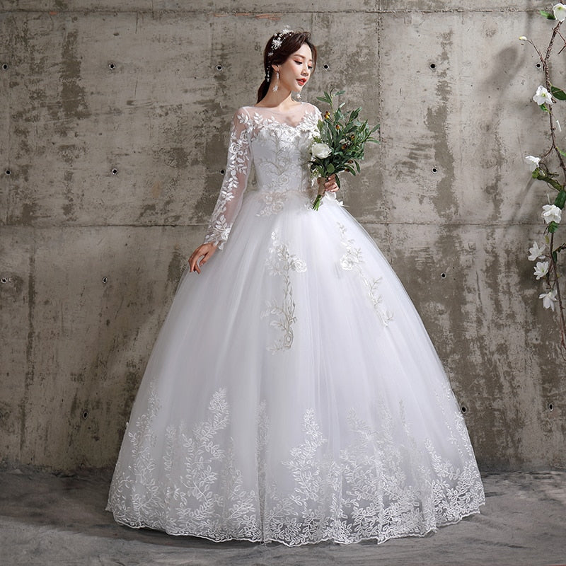 Luxury lace long sleeve wedding dress by The Clothing Company Sydney, plus size ball gown style with elegant detailing.