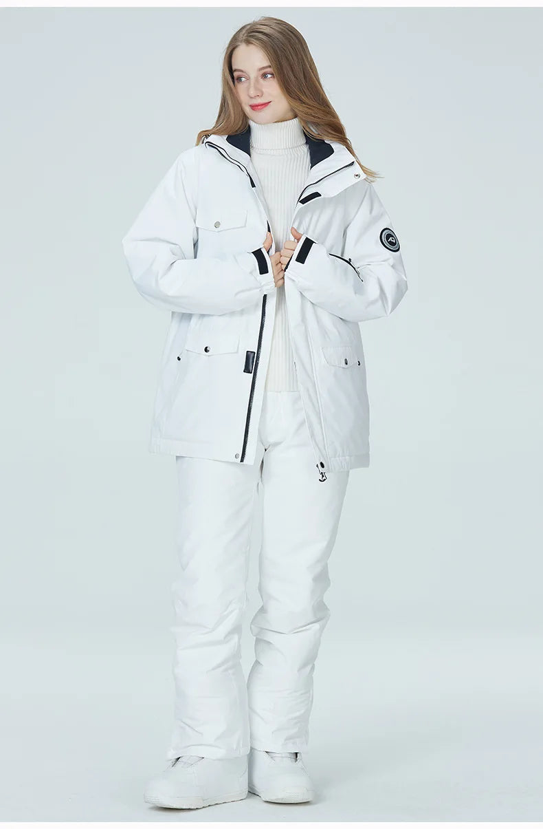 Women’s waterproof ski suit by The Clothing Company Sydney, featuring a snowboarding jacket and pants for winter sports.