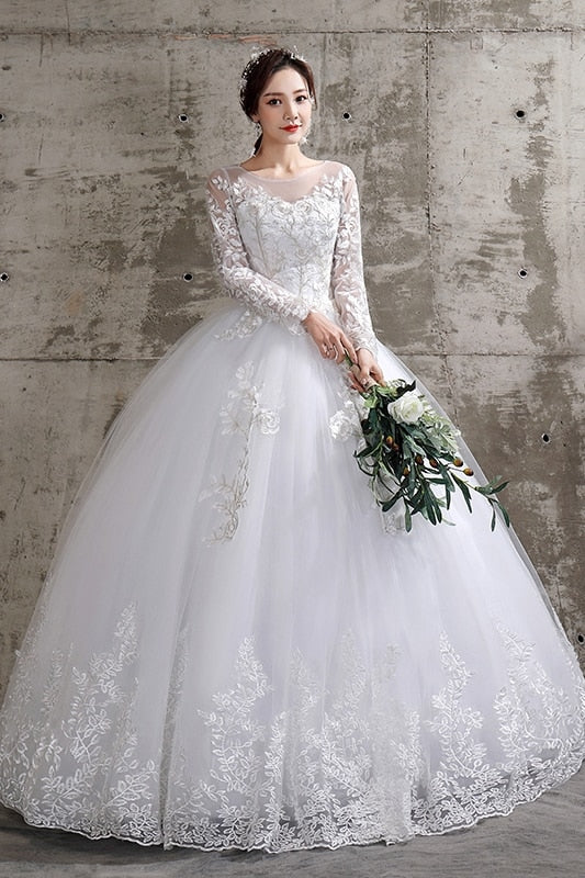 Long sleeve luxury lace wedding gown by The Clothing Company Sydney, plus size bridal dress with elegant fit and intricate lace details.