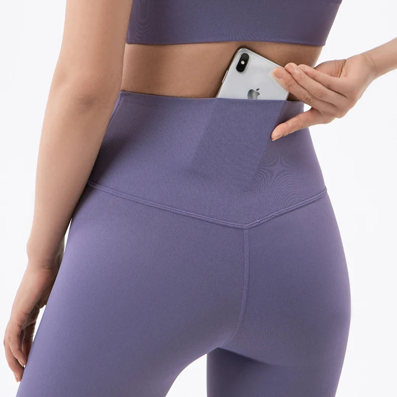 Nylon women's yoga set including breathable sports bra and matching leggings, ideal for gym and fitness activities.