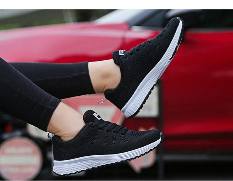 Women’s white breathable mesh casual sneakers from The Clothing Company Sydney, flat walking and gym vulcanized shoes.