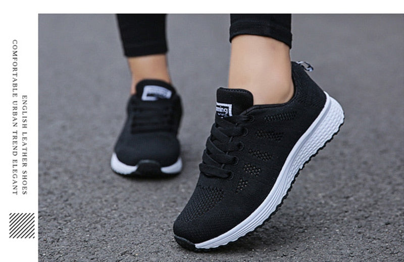 Women’s breathable white mesh casual sneakers by The Clothing Company Sydney, featuring flat design and vulcanized sole.