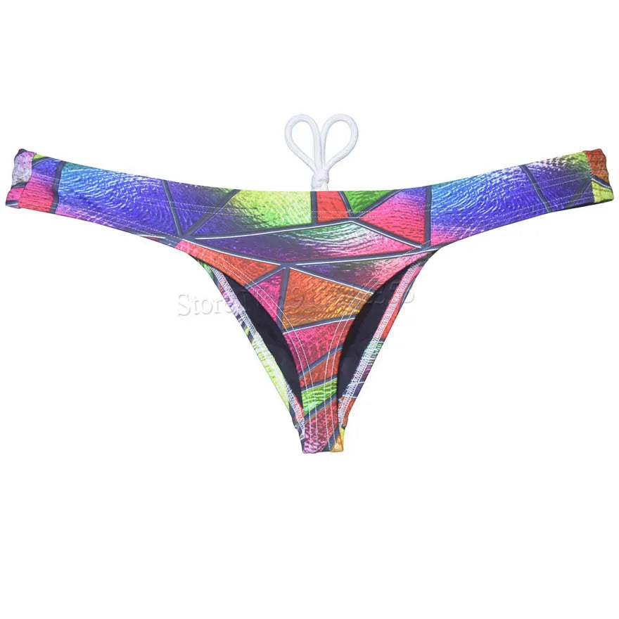 Men's bikini swim thong by The Clothing Company Sydney featuring printed T-back design, smooth fabric, ideal for beach or surfing.