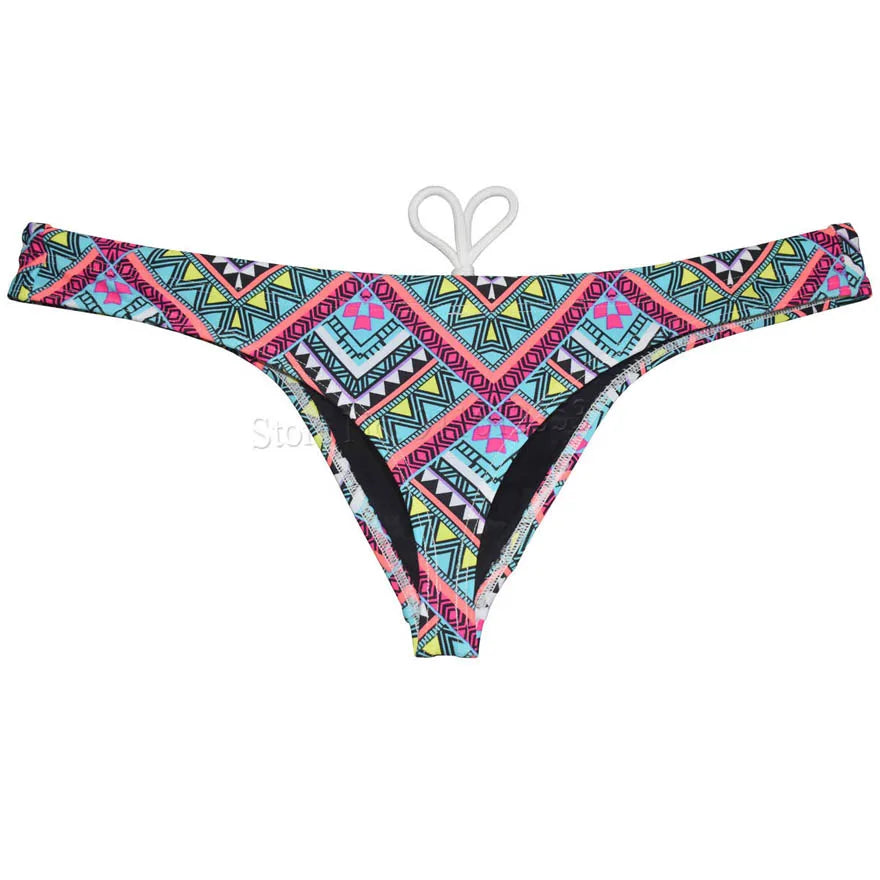 Men's printed bikini swim thong from The Clothing Company Sydney, smooth T-back swimsuit ideal for beachwear and surfing.
