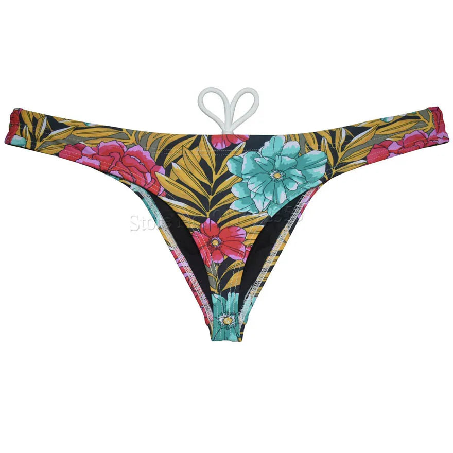 Men's bikini swim thong by The Clothing Company Sydney, printed T-back swimsuit with smooth fabric, ideal for beach and surfing.