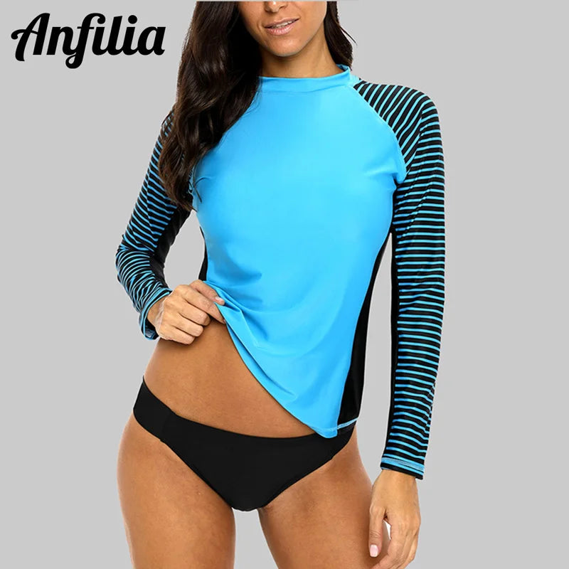 Women's long-sleeved striped rashguard swimwear by The Clothing Company Sydney, featuring patchwork design and UPF50+ sun protection.