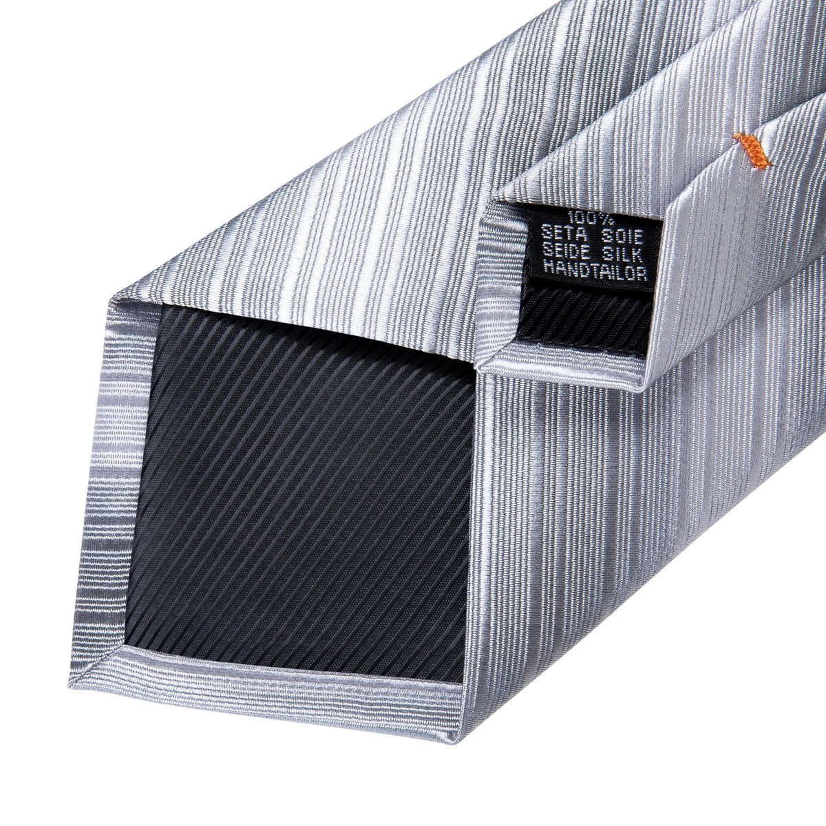 Men's gray paisley silk tie set with matching pocket square and cufflinks, ideal for wedding or formal occasions.