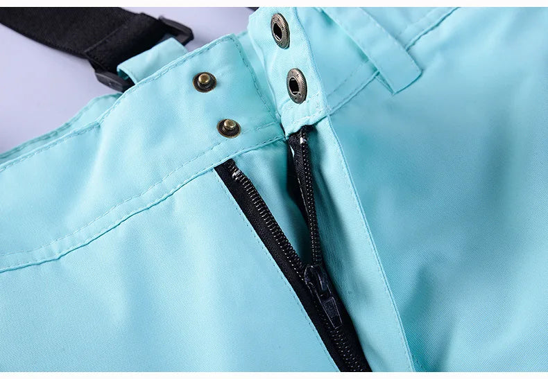 Women's waterproof ski suit by The Clothing Company Sydney, featuring a snowboarding jacket and pants set with windproof overalls.