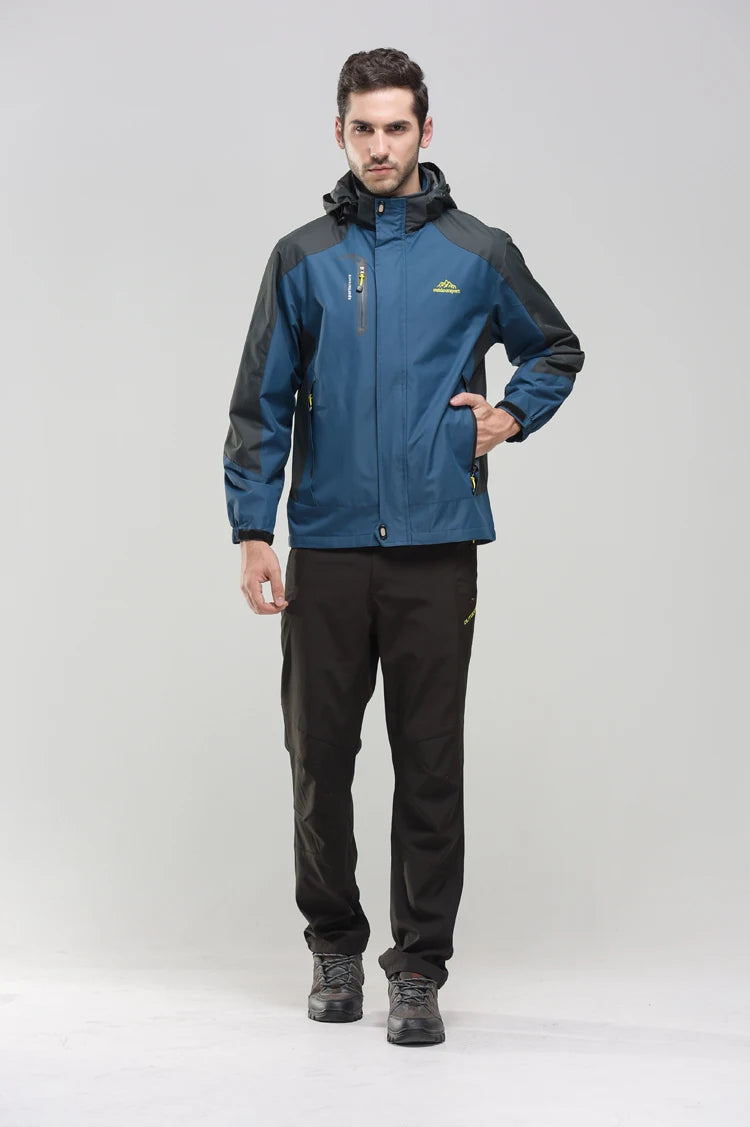Men's outdoor camping hiking jacket by The Clothing Company Sydney, shown in a rugged outdoor setting with zip pockets and waterproof fabric.