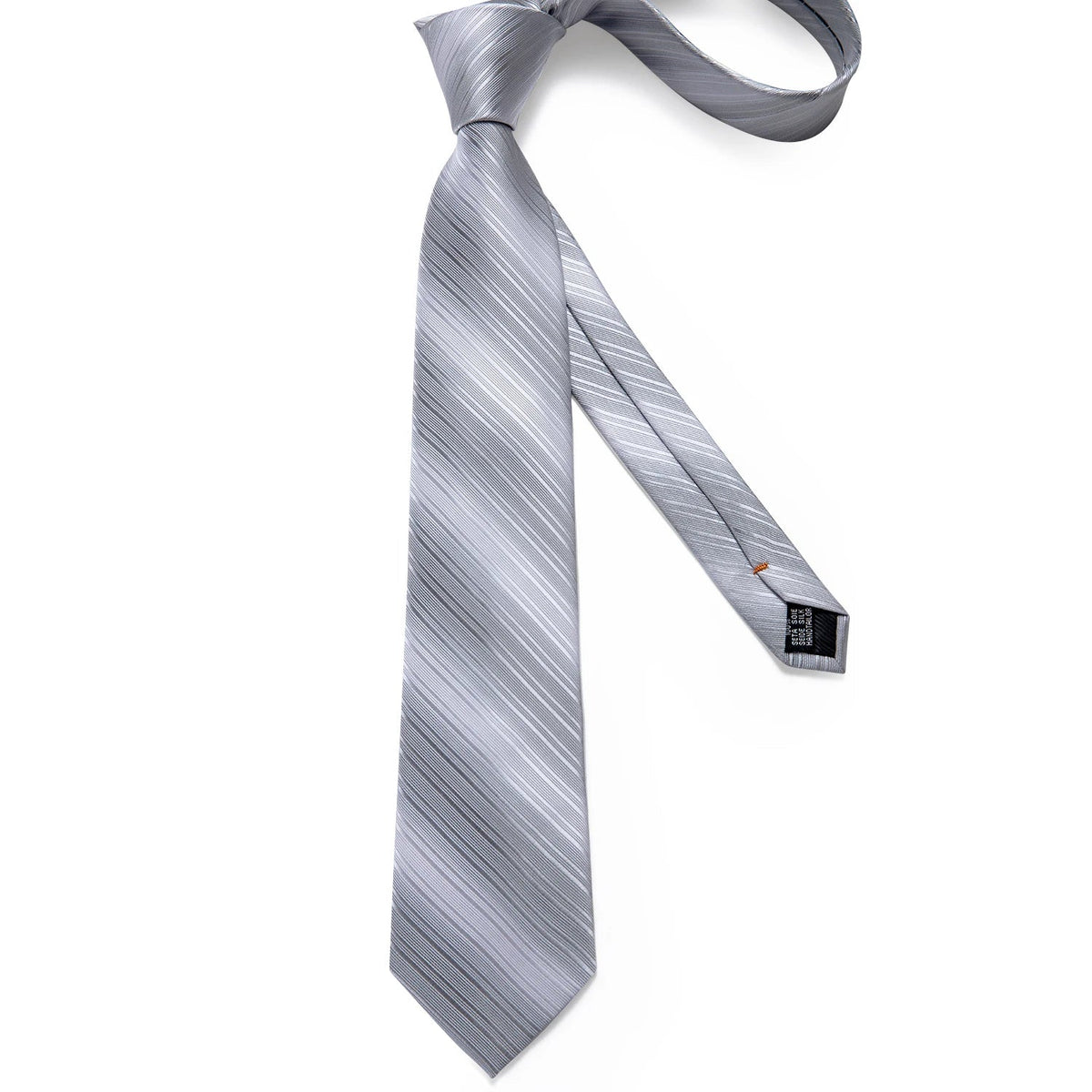 Men's gray paisley silk tie set with matching pocket square and cufflinks, perfect for wedding attire.