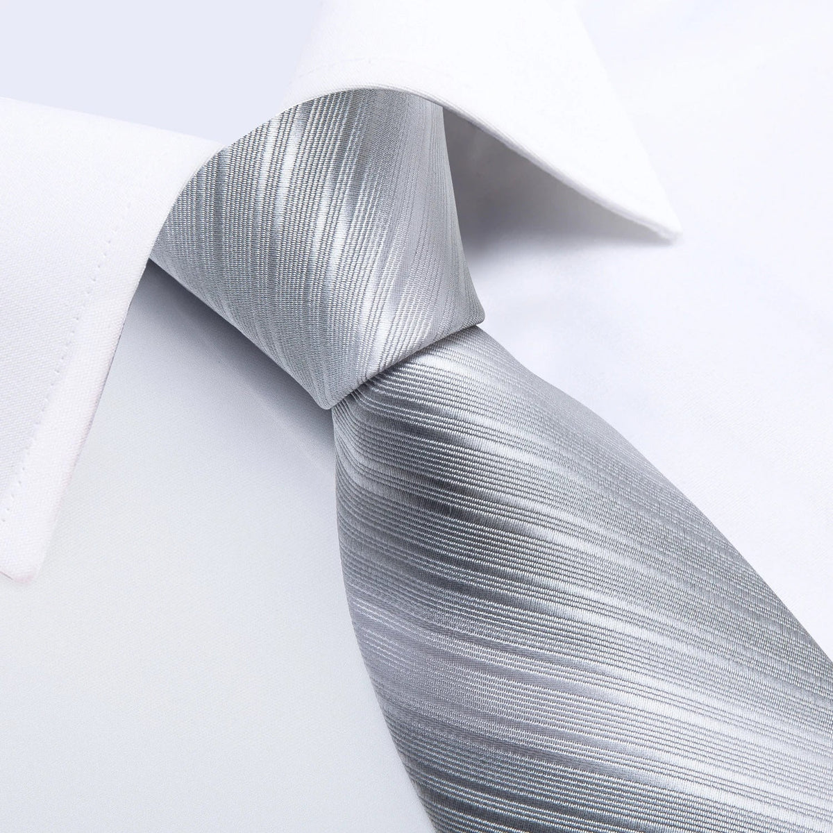 Men's gray paisley silk tie set with wedding tie, pocket square, and cufflinks by The Clothing Company Sydney, displayed on a white background.