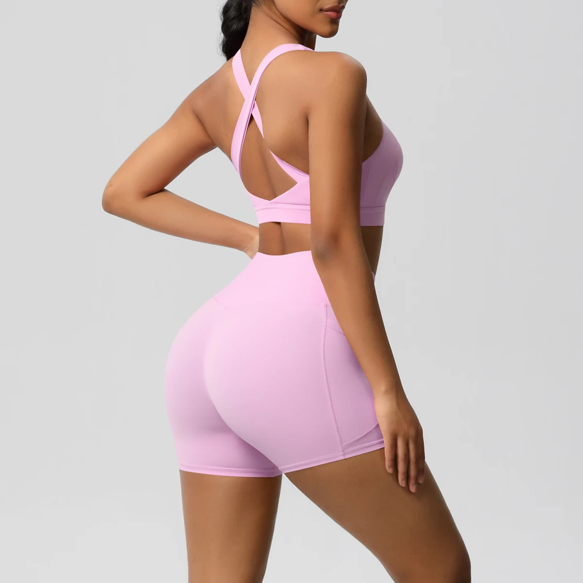 Women’s 2-piece fitness yoga set with pocketed gym shorts, crossover bra, and leggings from The Clothing Company Sydney.