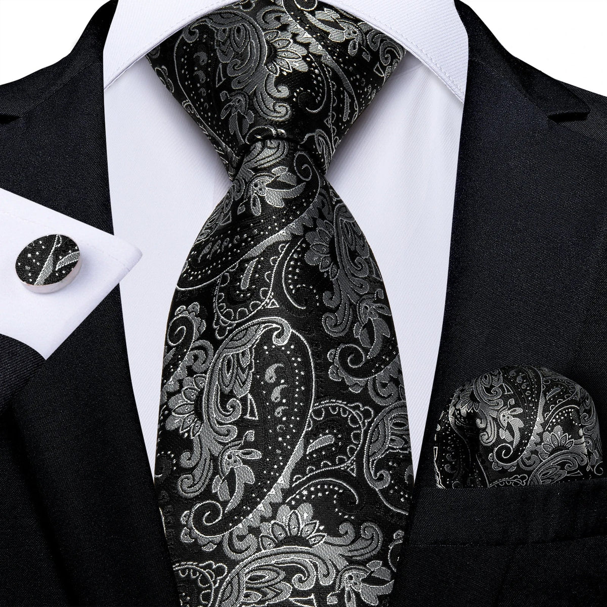 Men's gray paisley silk tie set with matching pocket square and cufflinks, ideal for weddings and formal occasions.