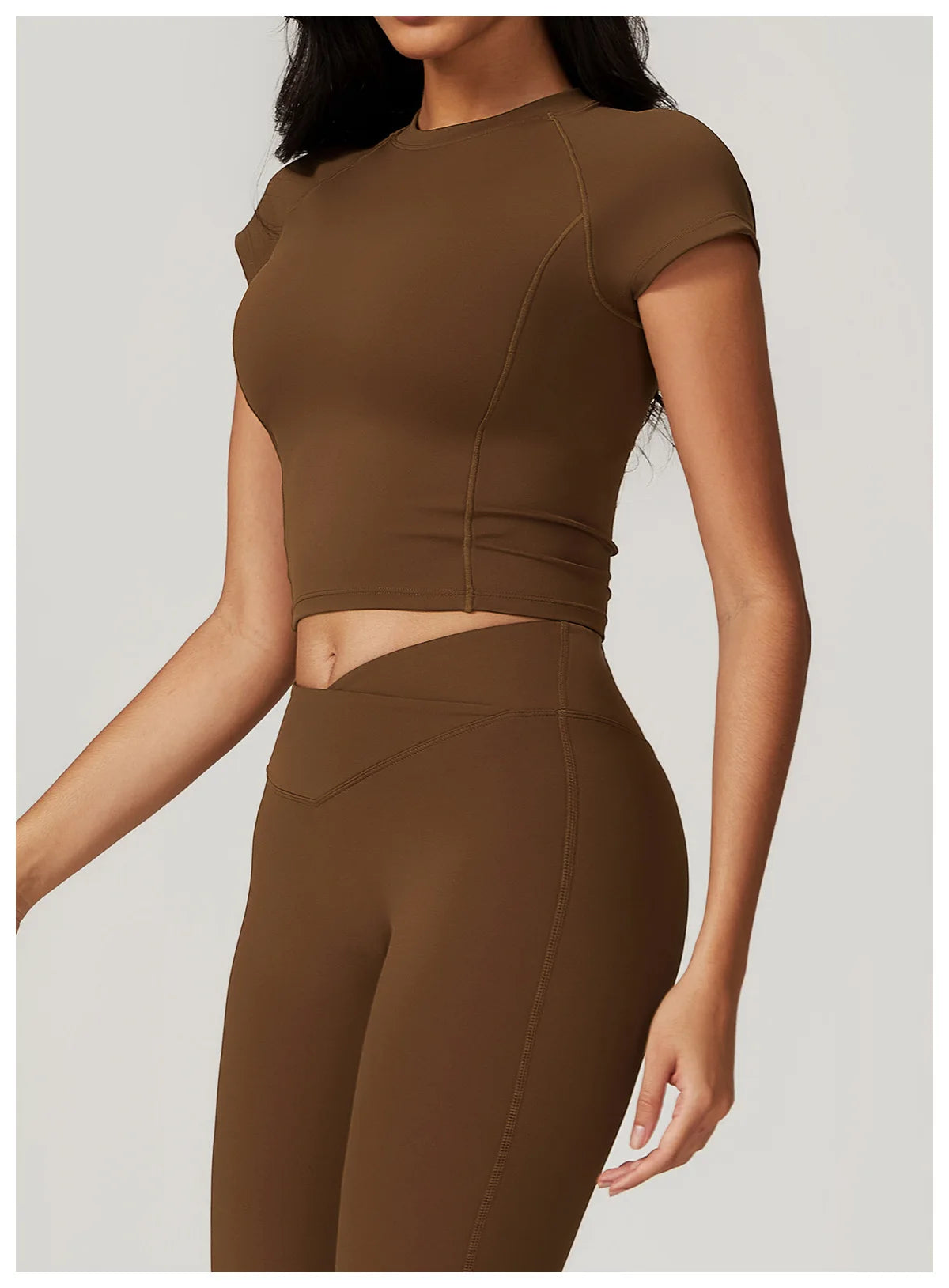 Two-piece women's fitness gym set with crop top, sports bra, leggings, and bike shorts by The Clothing Company Sydney.
