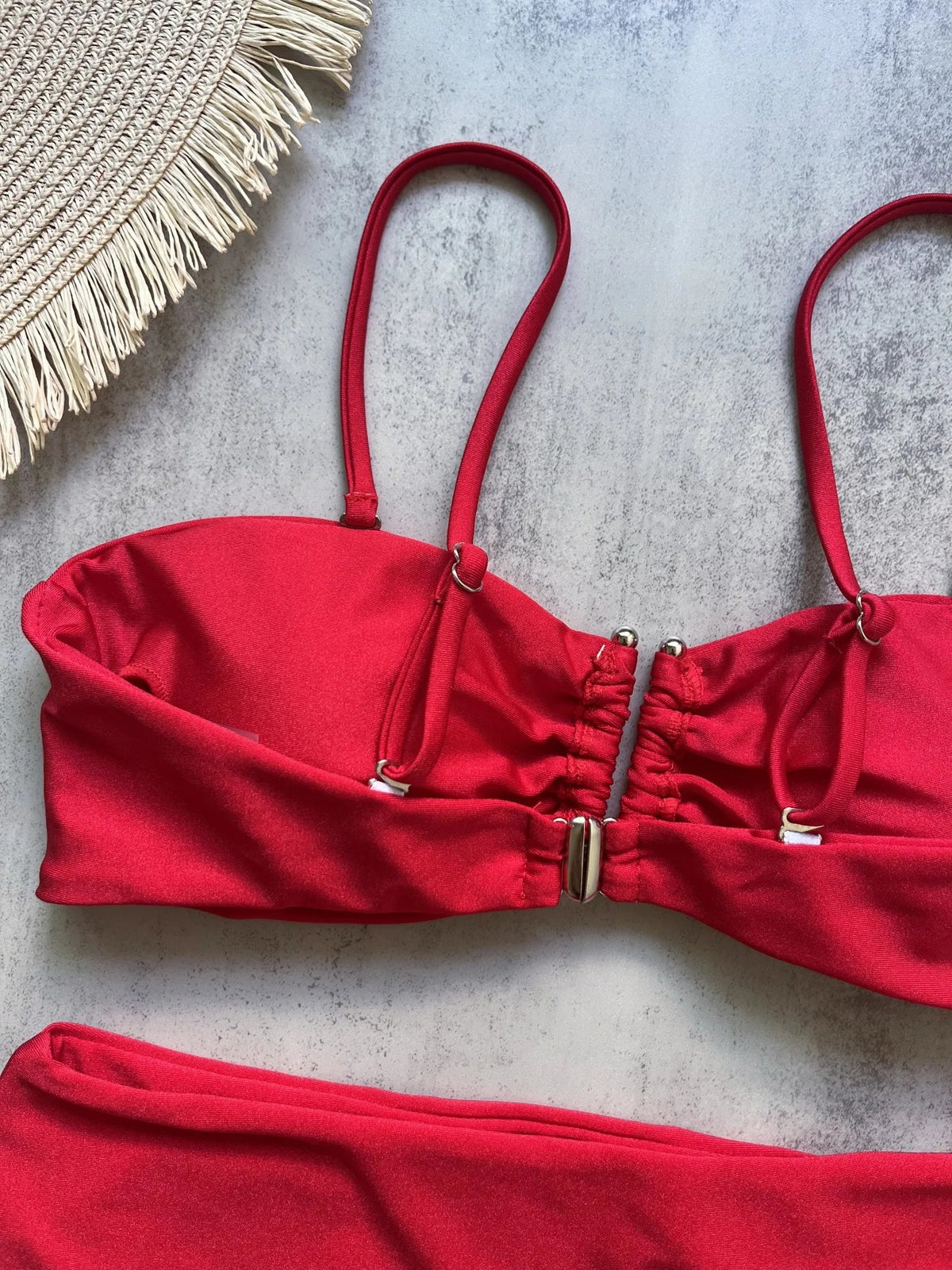 Two-piece bandeau bikini swimsuit with push-up top and thong bottoms from The Clothing Company Sydney, solid color beachwear set.