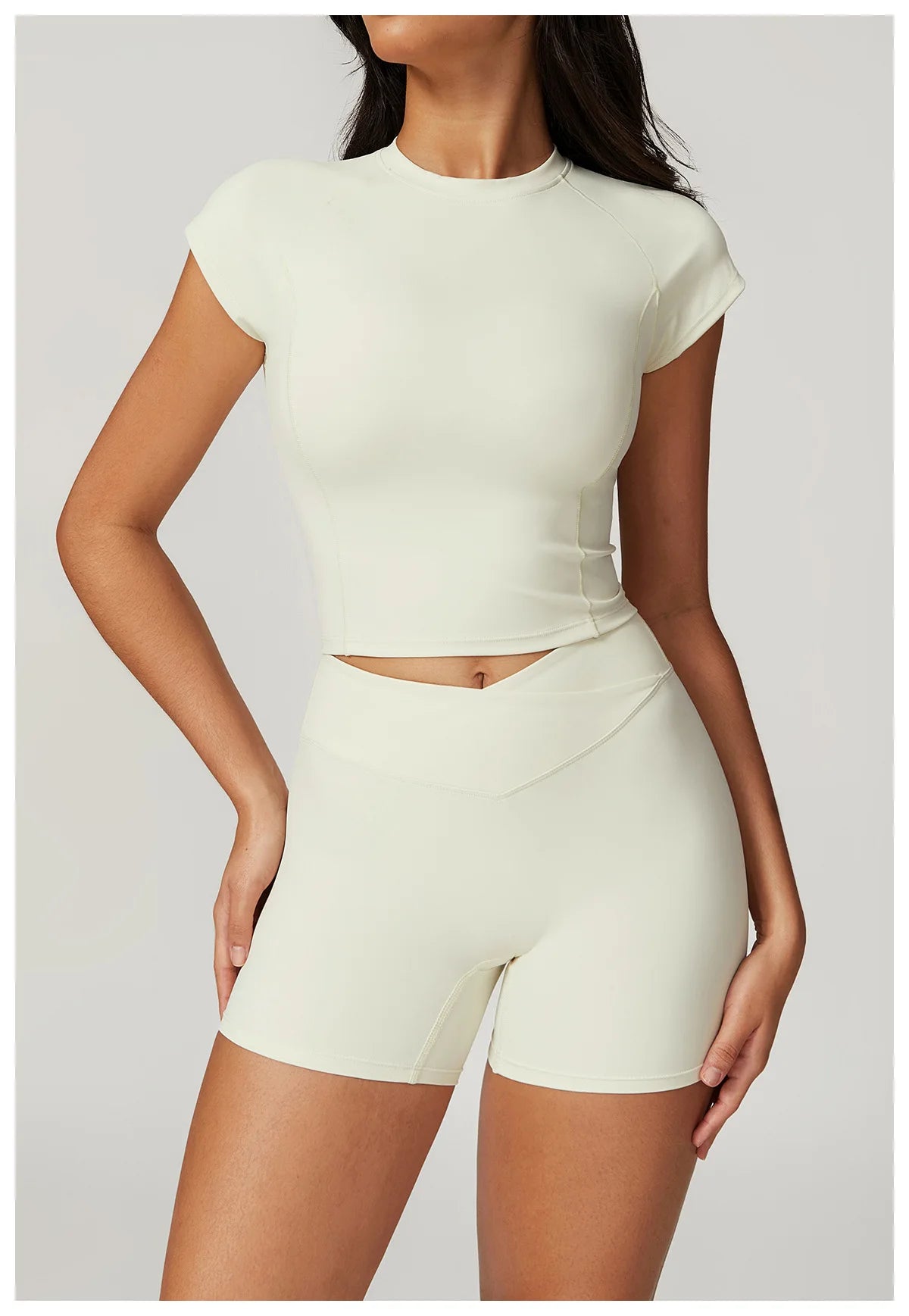 Two-piece women's fitness sportswear set with short sleeve crop top and gym leggings, by The Clothing Company Sydney.