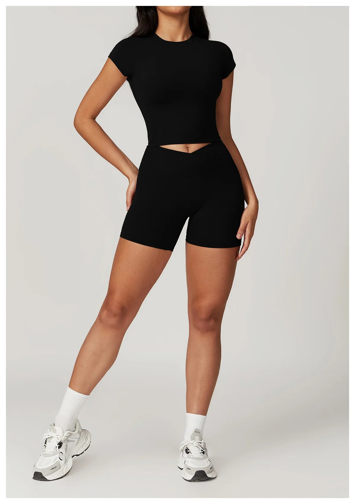 Two-piece women's yoga and gym sportswear set with crop top, sports bra, leggings, and bike shorts from The Clothing Company Sydney.