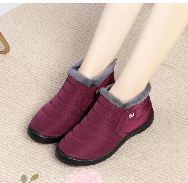 Women’s waterproof fur snow boots by The Clothing Company Sydney, slip-on ankle footwear with warm fur lining and durable soles.