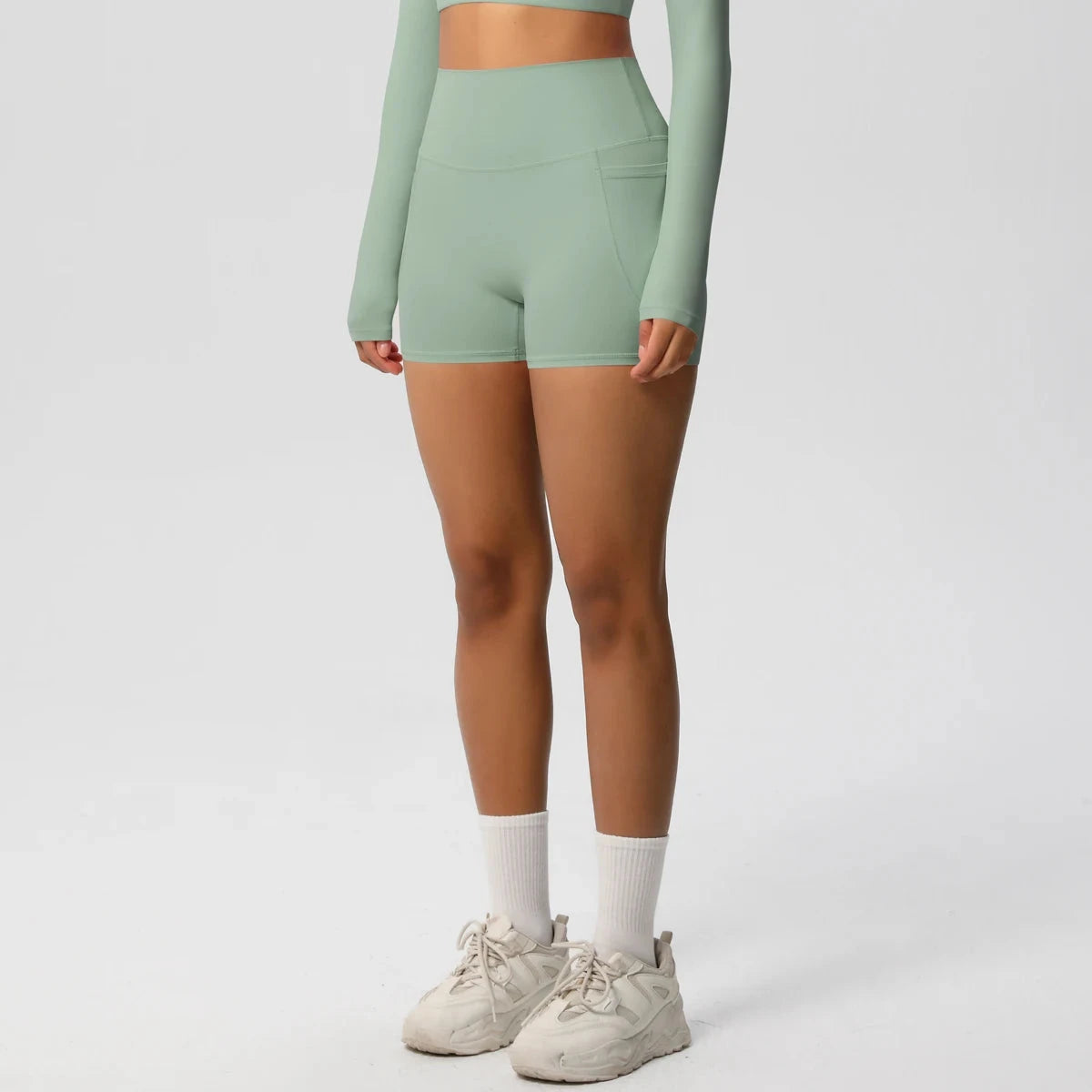 High-waisted bicycle yoga pants with pockets, quick-drying, breathable gym shorts for women, designed for workout and fitness activities.