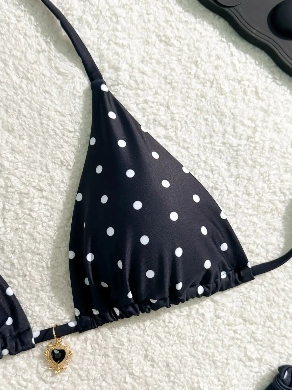 Black and white polka dot bikini set by The Clothing Company Sydney, two-piece swimsuit with classic beachwear style on a model.