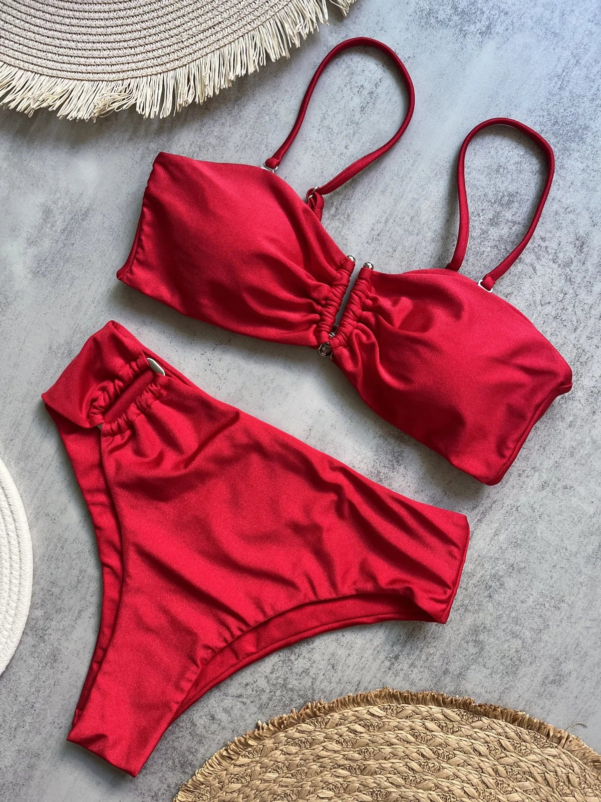 Two-piece bandeau bikini set with push-up design by The Clothing Company Sydney, featuring solid color swimwear and thong-style bottoms.
