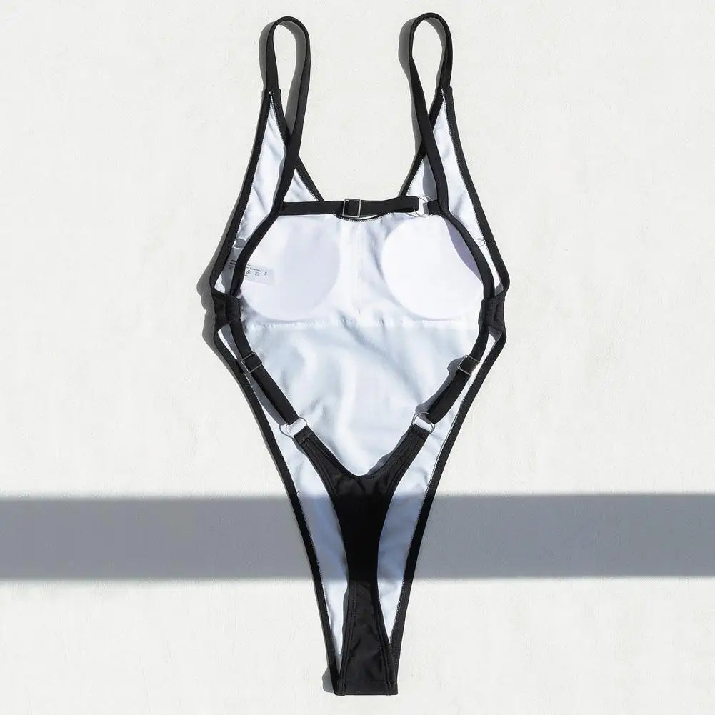 Backless micro thong one-piece swimsuit for women by The Clothing Company Sydney, featuring a sleek, minimal design and high-cut style.