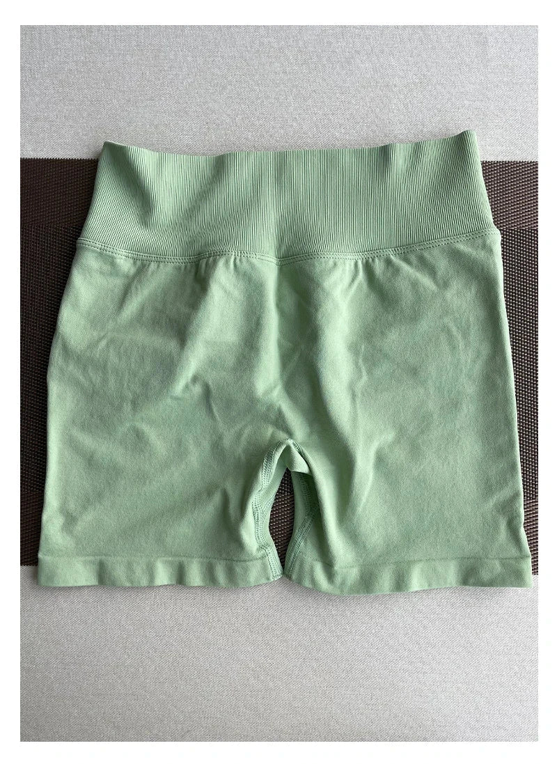 Solid seamless women's half pants from The Clothing Company Sydney, soft fitness shorts ideal for yoga, gym, running, and cycling.