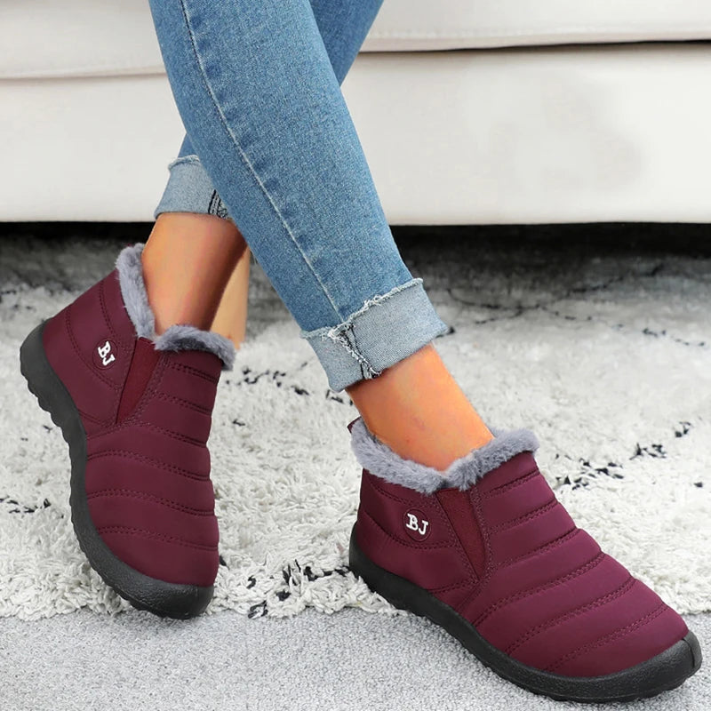 Women’s waterproof fur snow boots by The Clothing Company Sydney, slip-on ankle footwear with warm fur lining for winter wear.