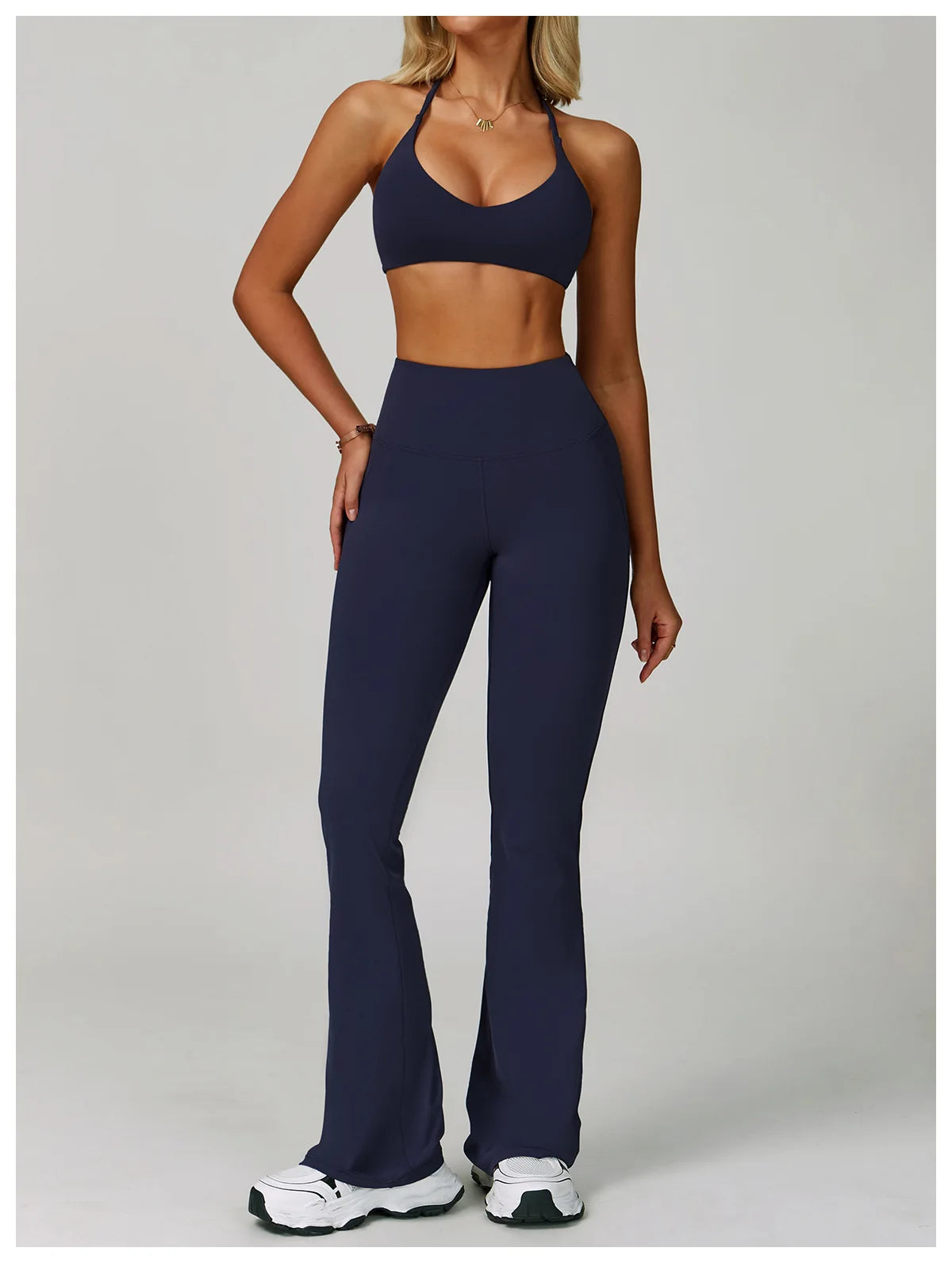 Women's fitness tracksuit set with high waist leggings and sports bra from The Clothing Company Sydney, ideal for yoga and workouts.
