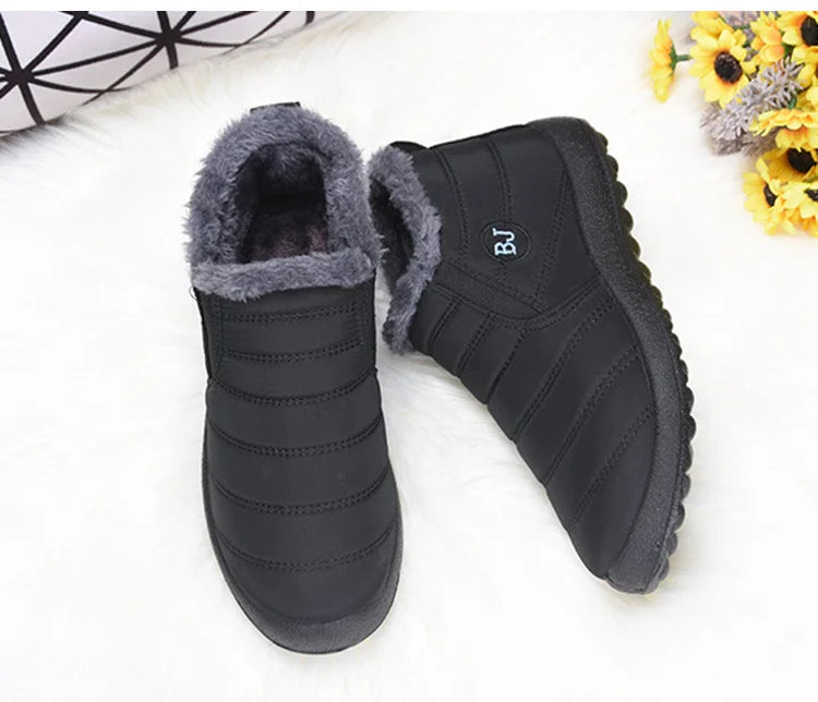 Women's waterproof fur snow boots by The Clothing Company Sydney, slip-on ankle footwear with cozy fur lining and durable sole.