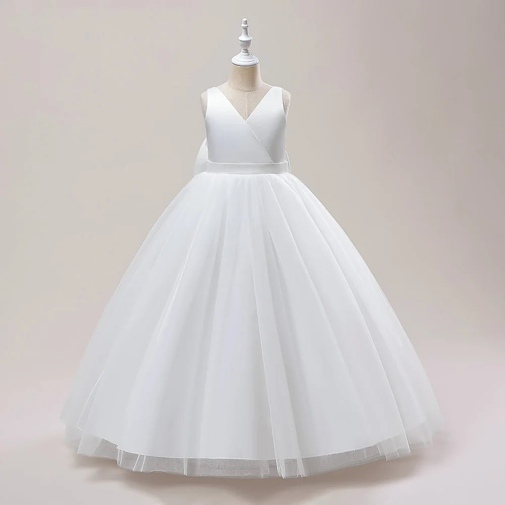 Girls long white bridesmaid wedding prom gown with a big bow, formal evening dress for kids by The Clothing Company Sydney