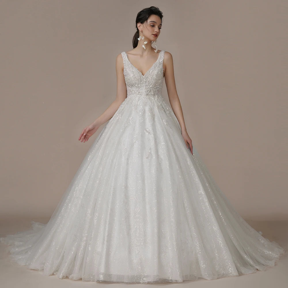 Ivory strapless A-line glitter wedding dress with off-the-shoulder design and bling details, designed for brides by The Clothing Company Sydney