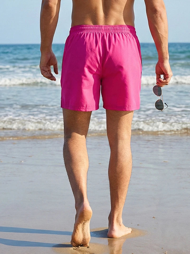 Men's palm tree print board shorts from The Clothing Company Sydney, quick-dry swim trunks with zipper pockets and beach mesh liner.