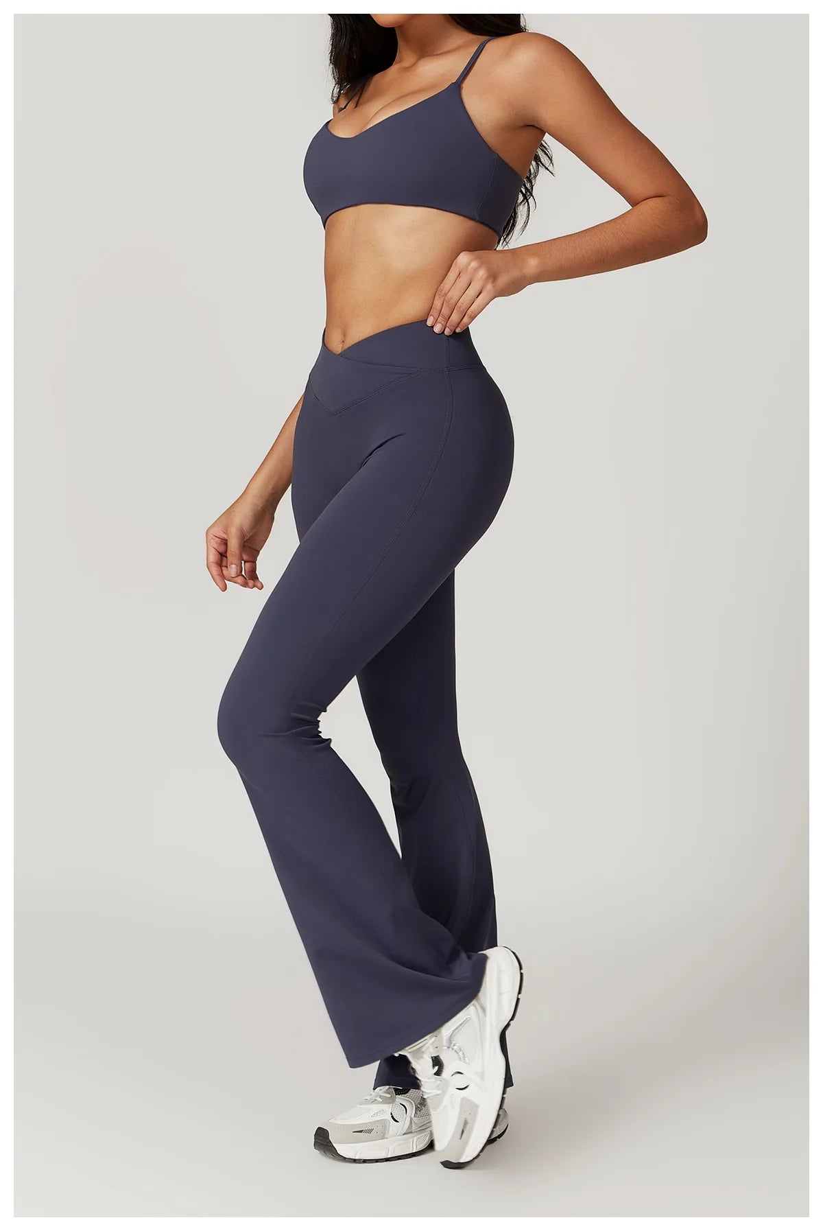 Two-piece women's fitness set from The Clothing Company Sydney featuring a short sleeve crop top, sports bra, and gym leggings.
