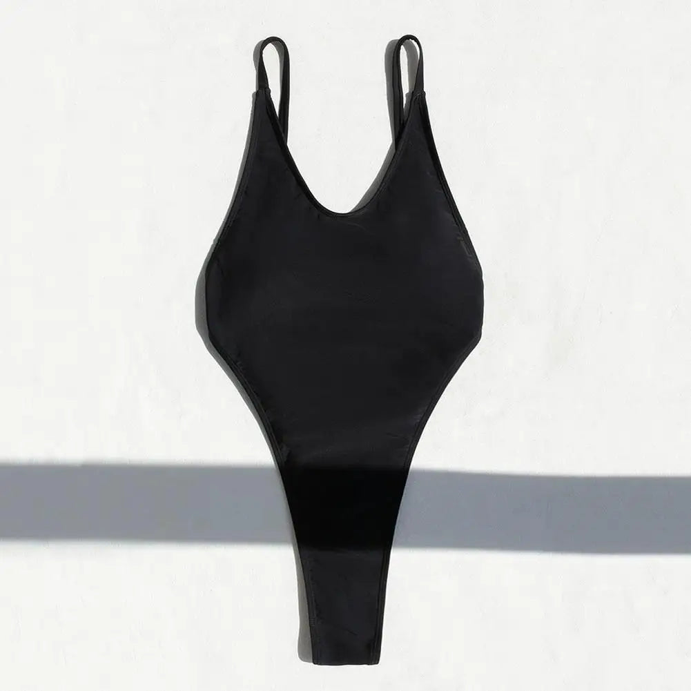 Backless micro thong one-piece swimsuit for women by The Clothing Company Sydney, showcasing its sleek, minimal design and fit.