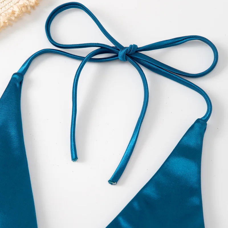 Two-piece metallic satin Brazilian bikini swimsuit with halter top and high-cut design, perfect for beachwear by The Clothing Company Sydney.