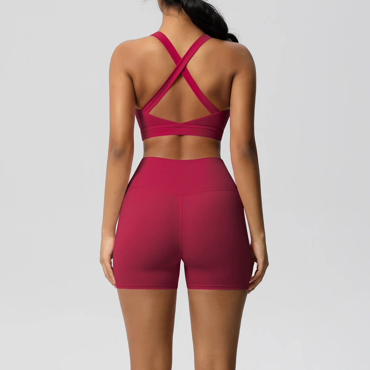 Women's fitness yoga set with pocketed gym shorts, crossover bra, and leggings from The Clothing Company Sydney, ideal for active wear.