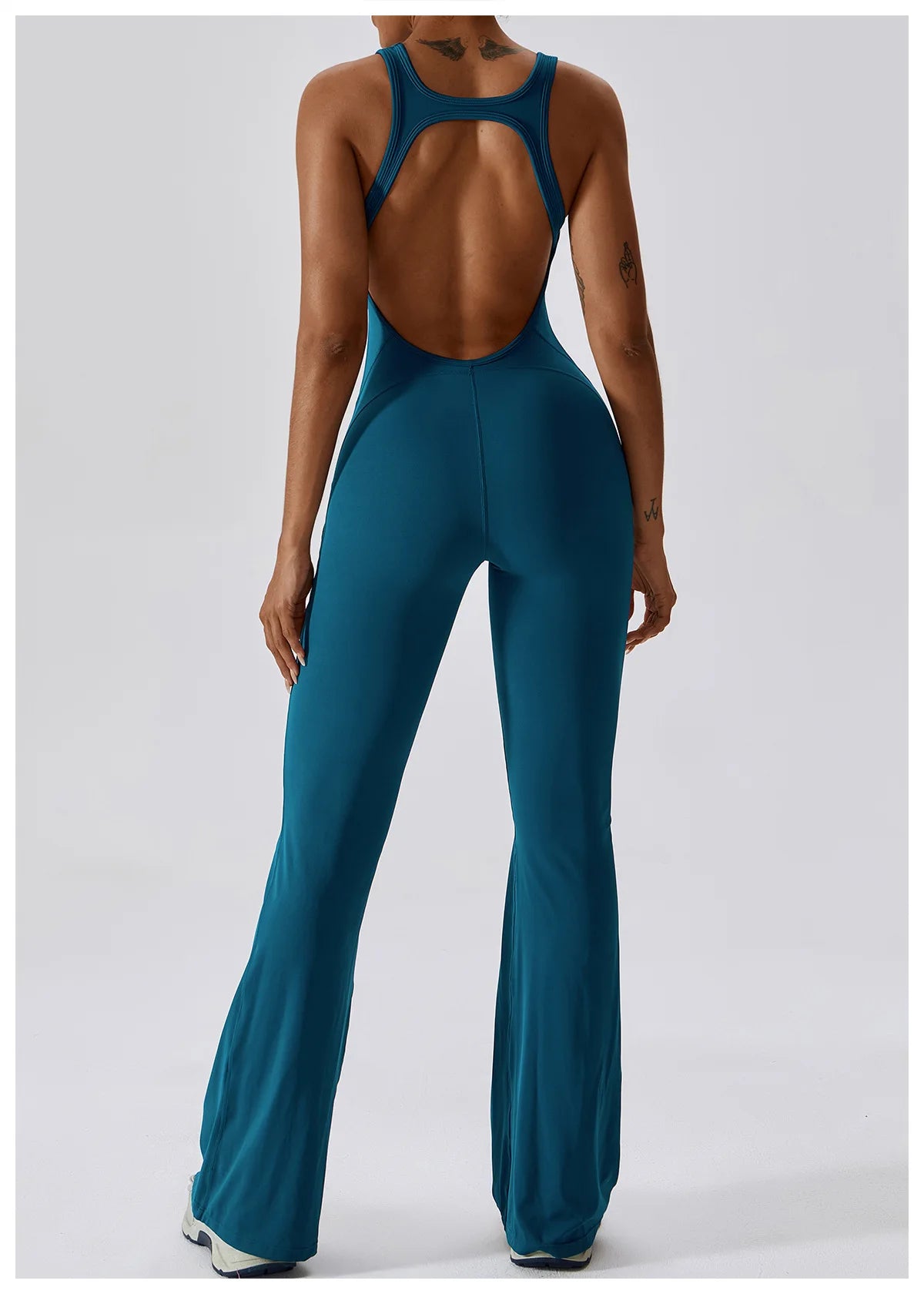 Open back V jumpsuit gym set for women, stylish fitness romper with stretch fabric for yoga, training, and workout activities.