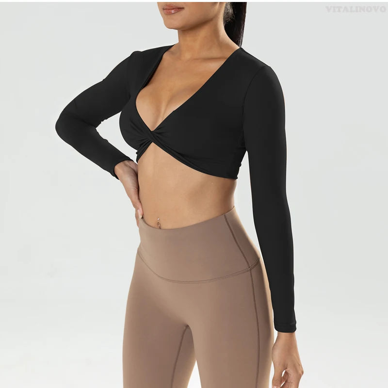 The Clothing Company Sydney long sleeve gym crop top with twist design, deep V neckline, padded, quick-dry fabric for fitness and yoga.