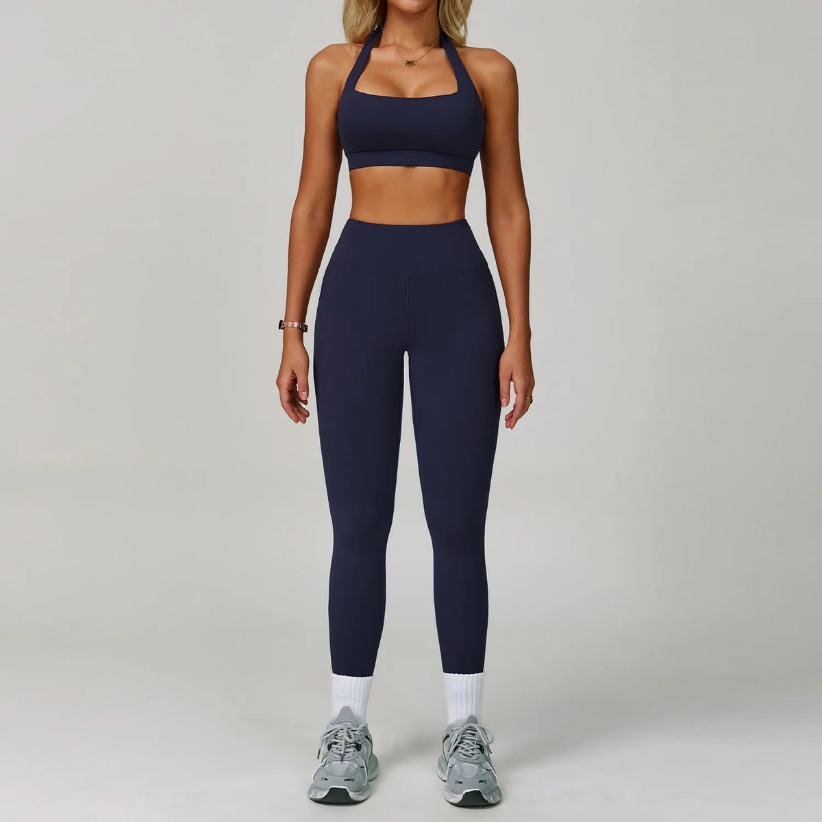 Women's fitness tracksuit set by The Clothing Company Sydney, featuring high waist leggings and a matching sports bra for yoga and workouts.