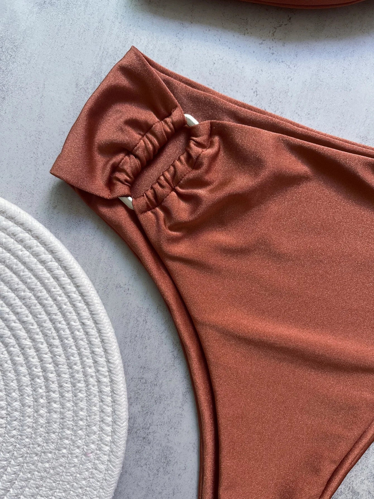 Two-piece bandeau bikini swimsuit by The Clothing Company Sydney featuring push-up top and Brazilian thong bottoms, solid beachwear.