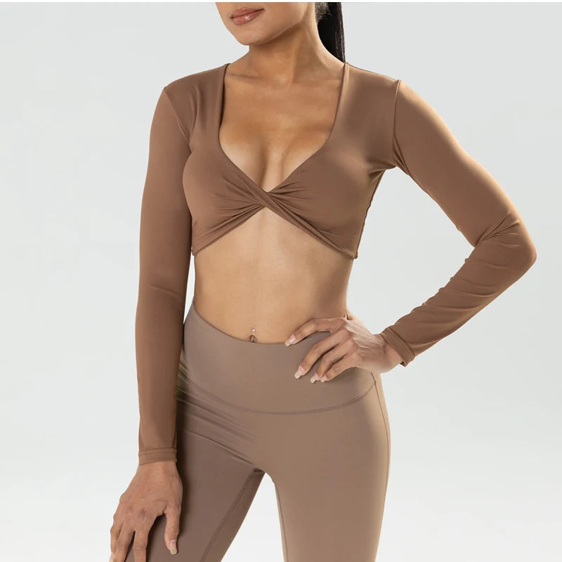 Long sleeve gym crop top by The Clothing Company Sydney, twist detail, deep V neckline, quick-dry fabric, padded sports fitness yoga shirt.