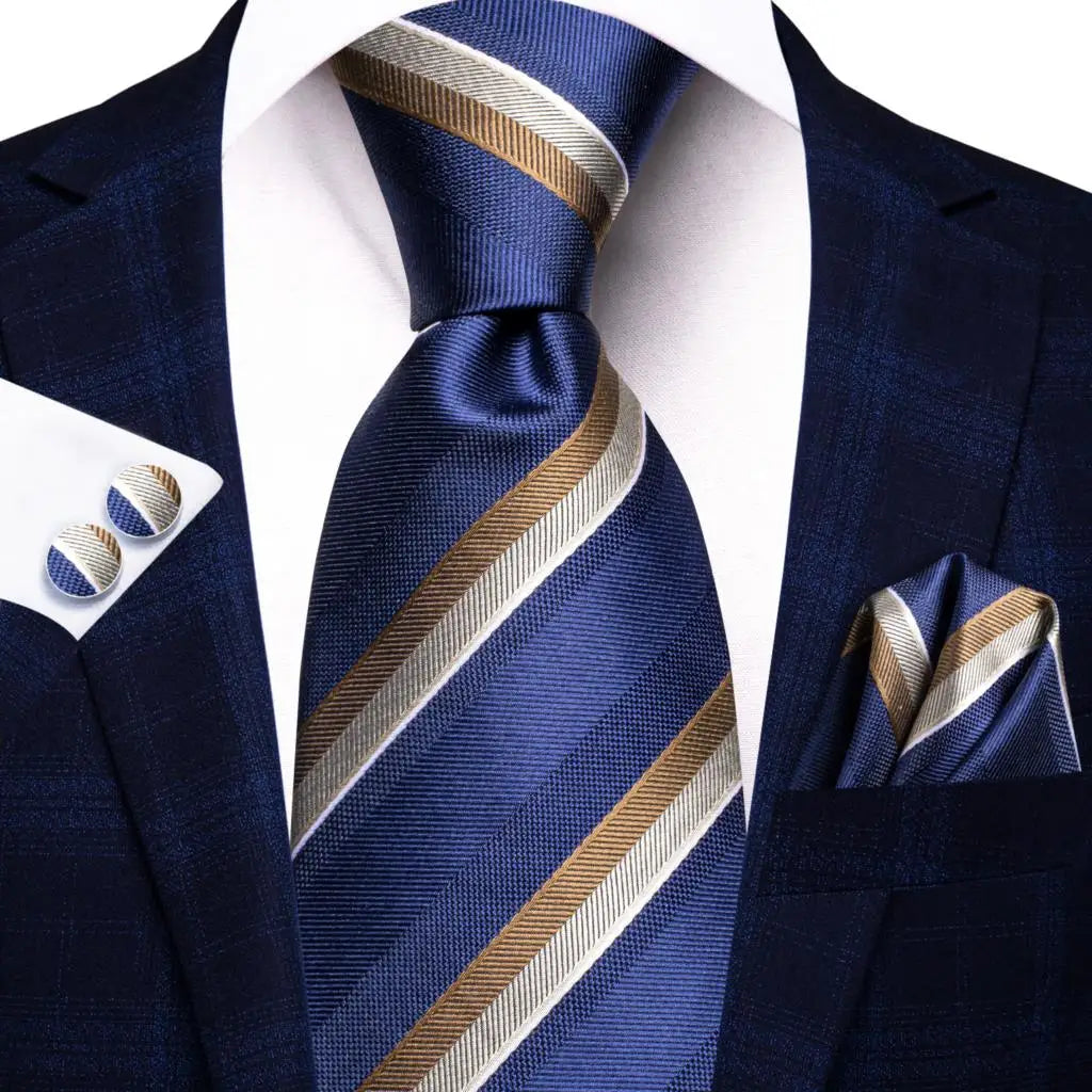 Blue paisley silk tie set including necktie, cufflinks, and handkerchief from The Clothing Company Sydney, displayed on a white background.