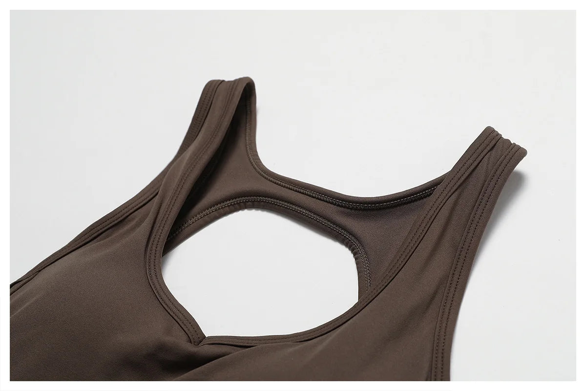 Open back V jumpsuit gym set for women, made by The Clothing Company Sydney, featuring stretch fabric and a sleek fitness bodysuit design.