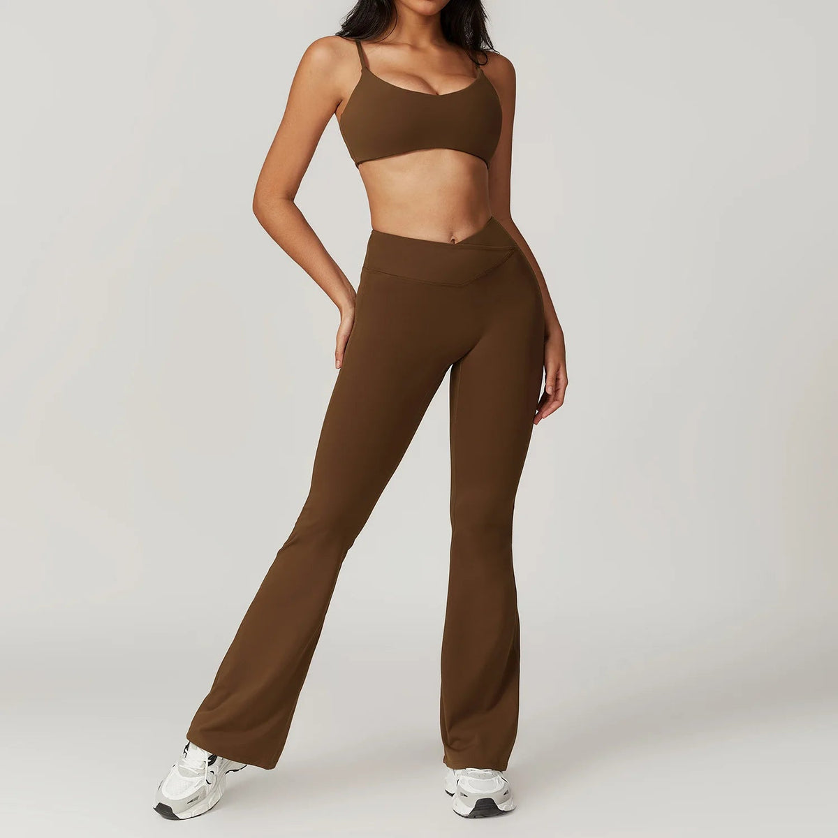 Two-piece women's fitness set including a crop top, sports bra, and leggings from The Clothing Company Sydney, designed for active workouts.