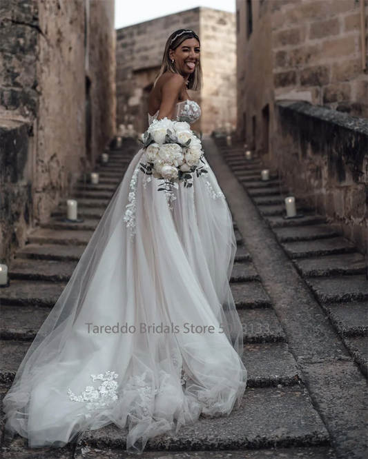 Customized Strapless Wedding Dress Featuring Stunning Crystals Lace Appliques and Flowy Silhouette Bridal Dress The Clothing Company Sydney