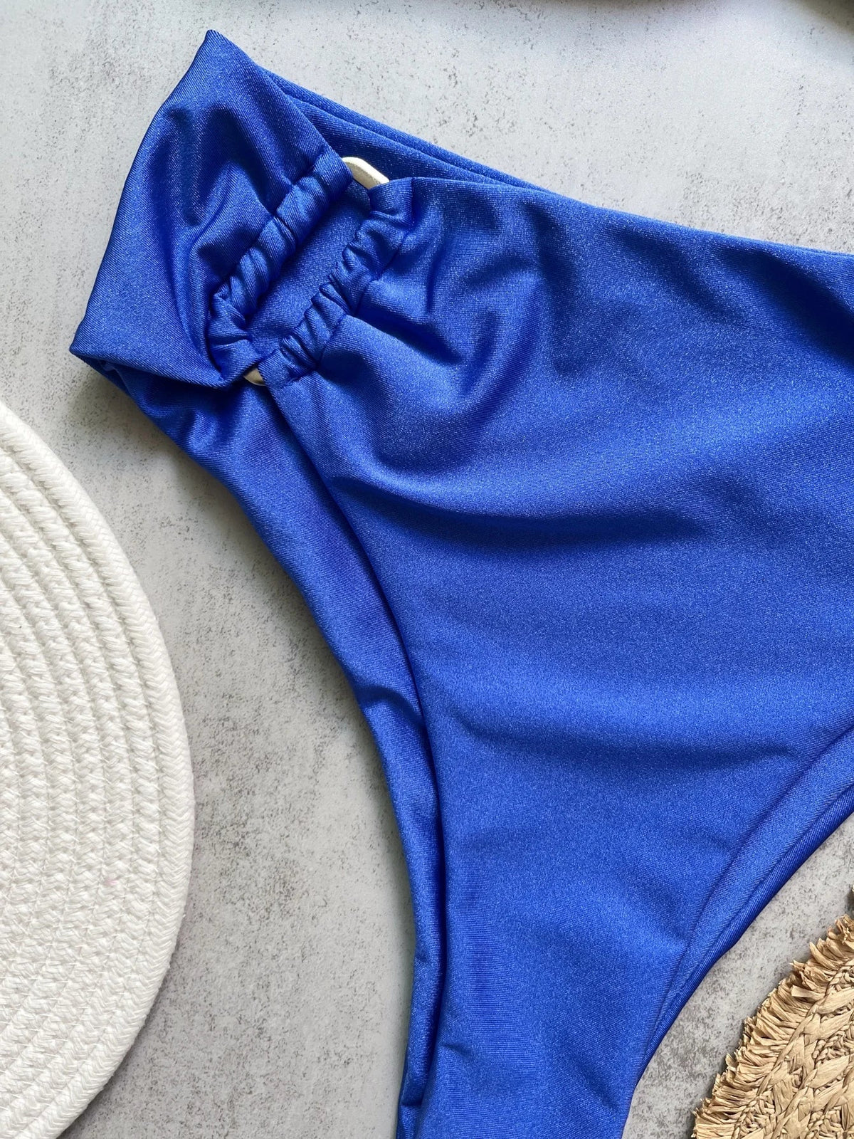 Two-piece bandeau bikini set by The Clothing Company Sydney, with push-up top and thong bottom, solid color swimwear for the beach.
